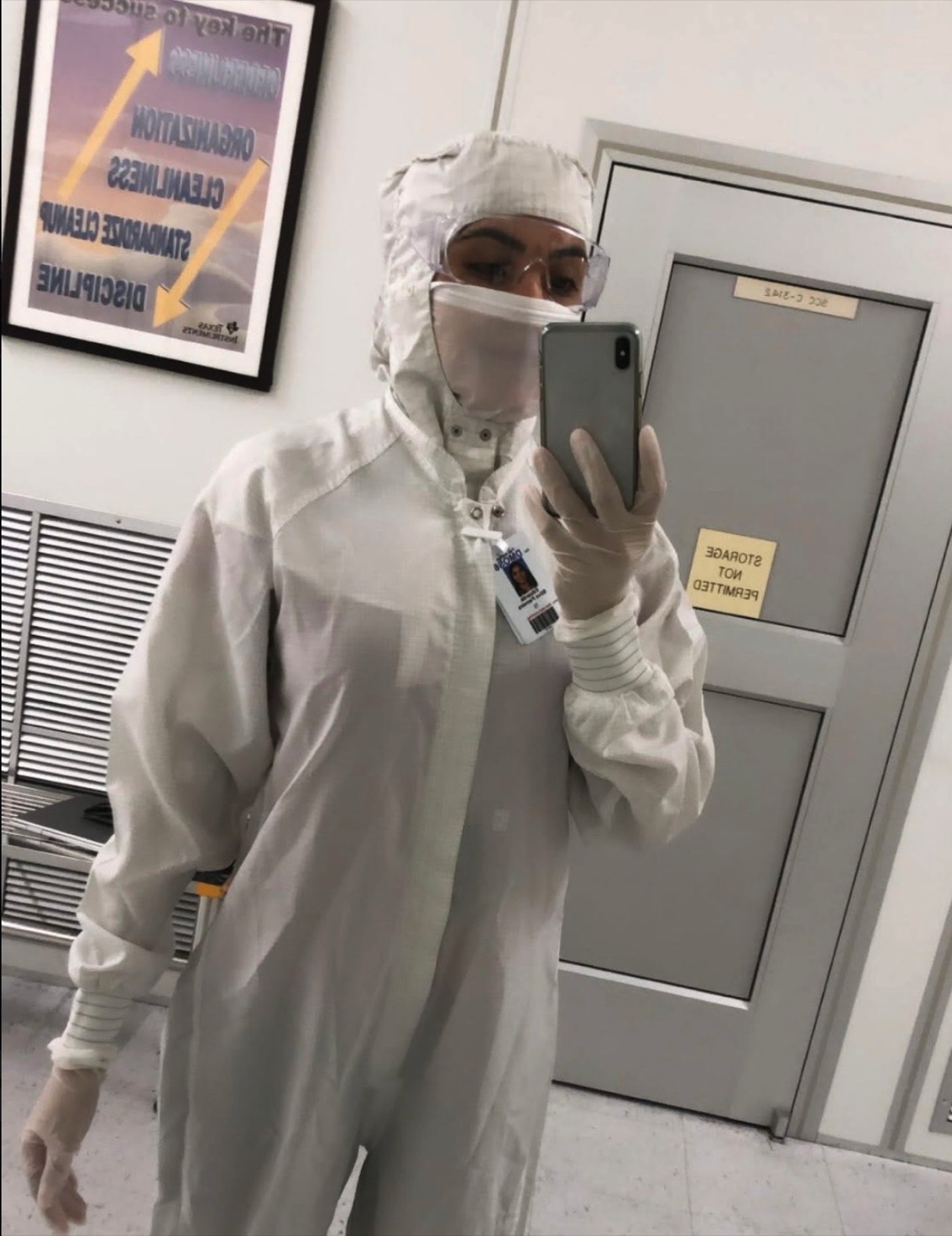Suited head to toe in the full cleanroom suit, goggles, and gloves at Texas Instruments
